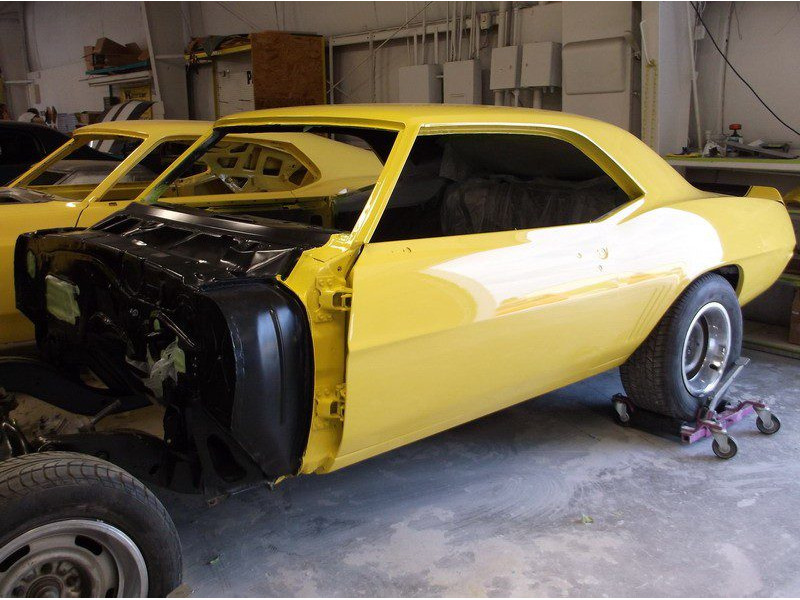 Yellow Camaro during restoration.