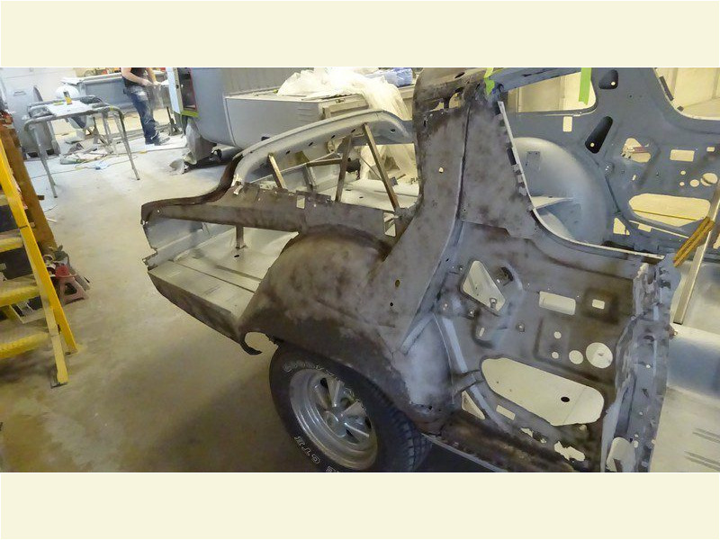 Car body restoration in progress.