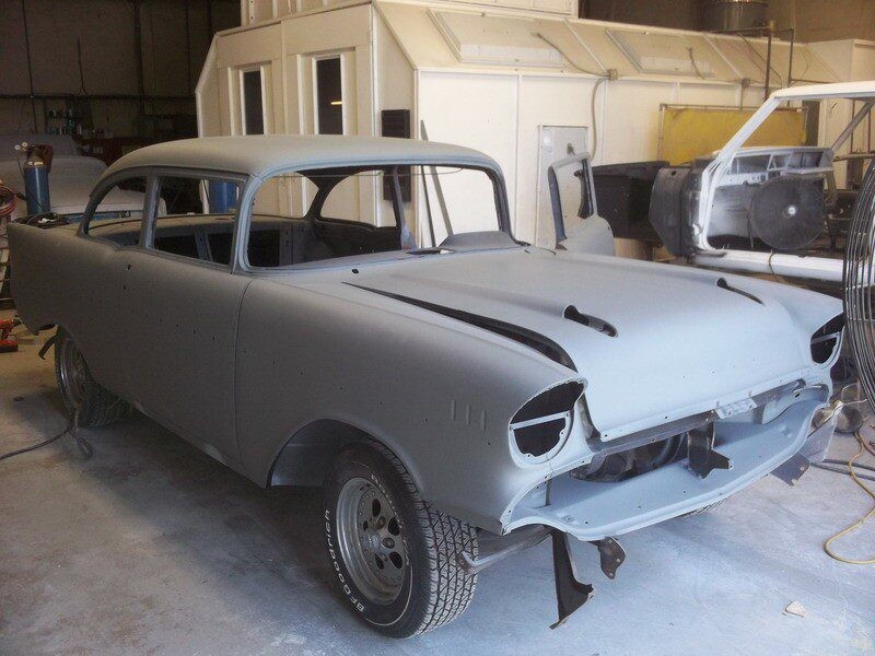 Primered 1957 Chevy Bel Air body.