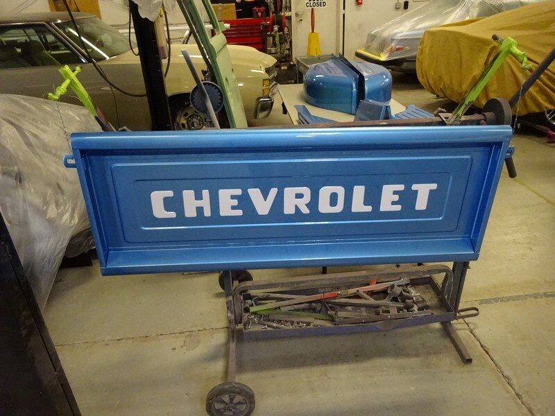 Blue Chevrolet truck tailgate.