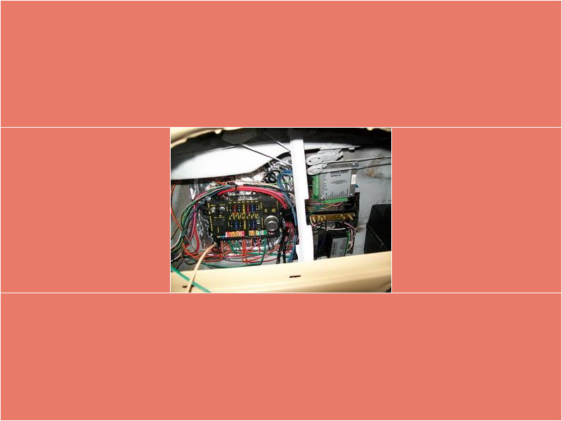 Here's an alt tag for the image: `Vehicle's electrical system and fuse box`