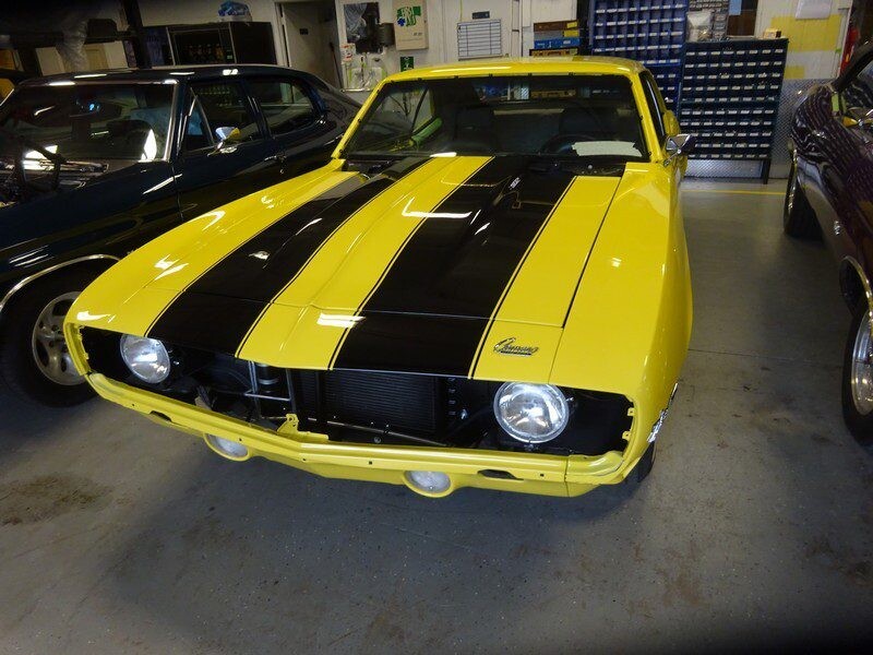 Yellow and black classic Camaro.