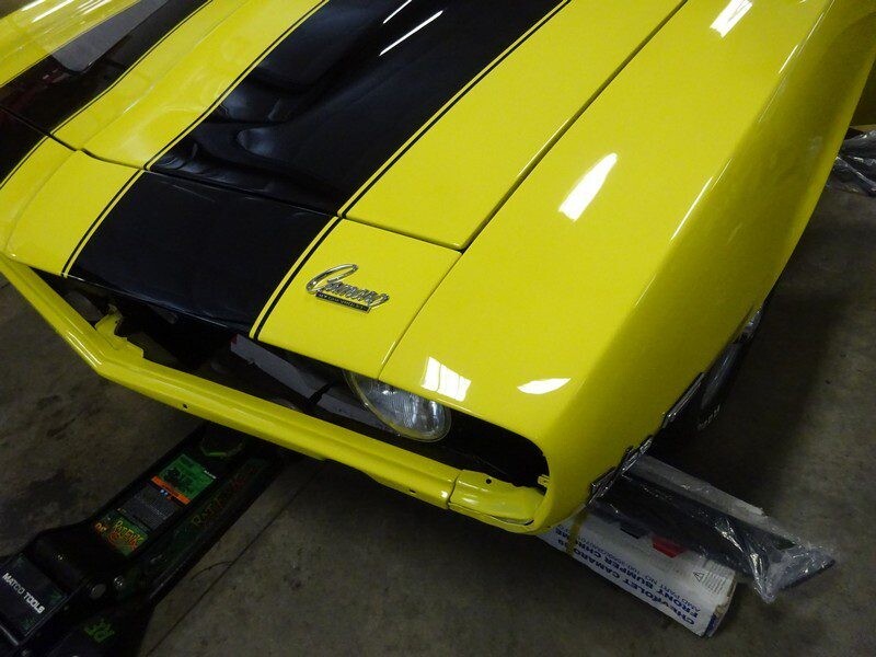 Yellow Camaro with black stripes.