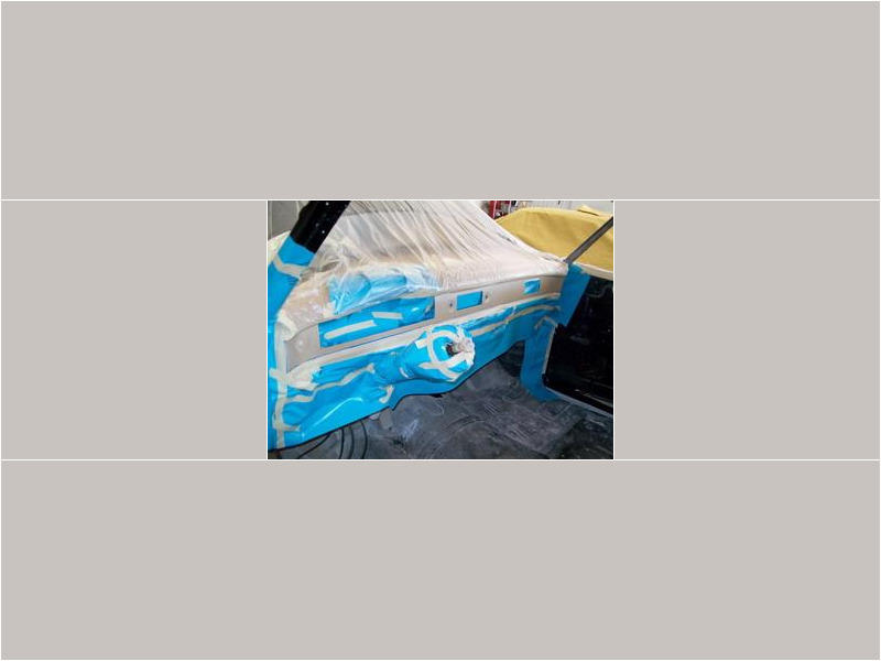 Here's an alt tag for the image: Classic car dashboard, being repainted.