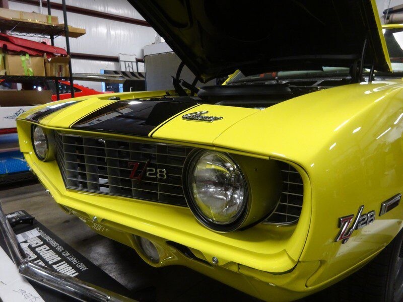 Yellow 1969 Camaro Z28 front view.