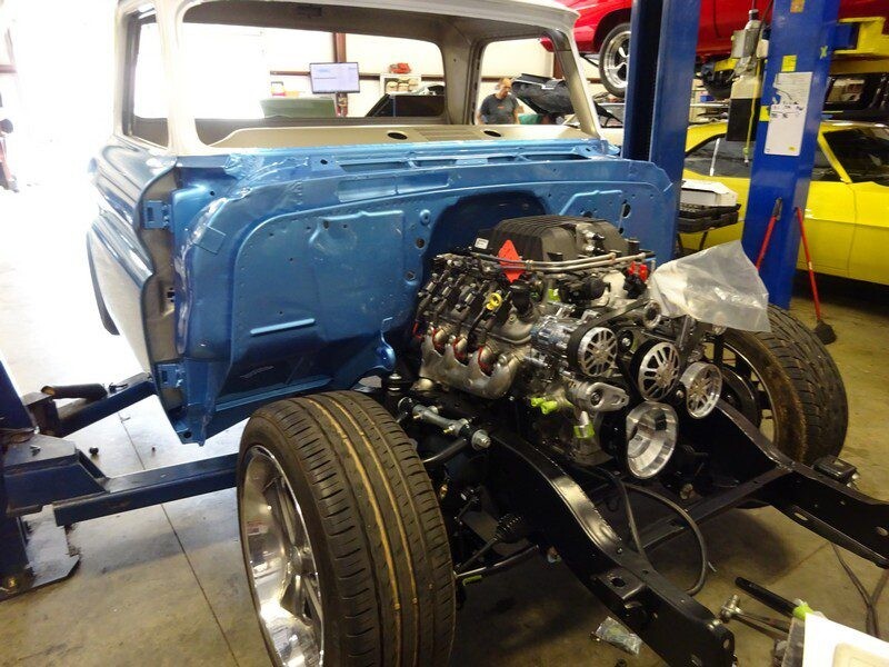 Blue classic truck engine swap in progress.