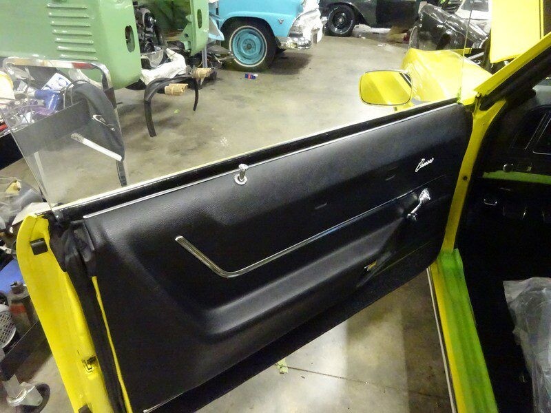 Yellow Camaro's interior door panel.