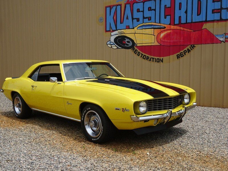 Yellow color car on the display of the website