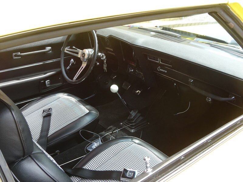Classic Camaro interior, black and white seats.