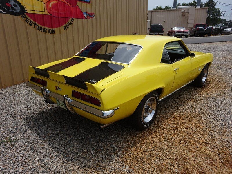 Yellow 1969 Camaro SS muscle car.