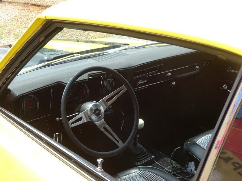 Yellow Camaro interior, classic car.
