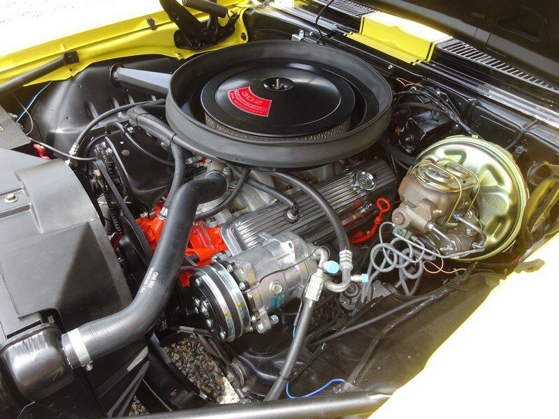 Yellow Camaro engine bay detail.