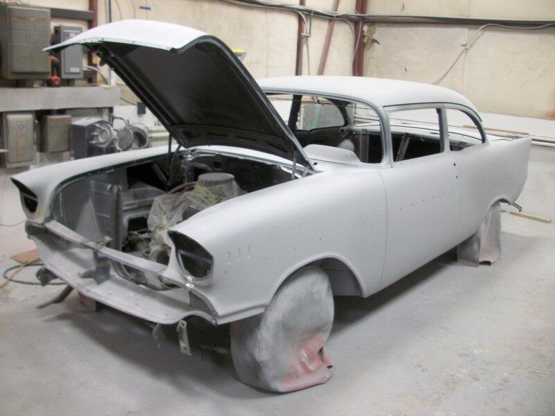 Primered classic car under restoration.