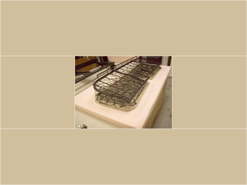 Here's an alt tag for the image: `Vintage car seat springs and foam`