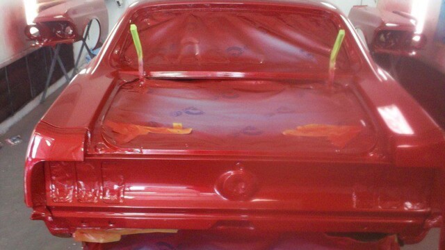 Red classic car, freshly painted.