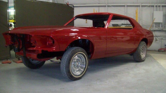 Red Ford Mustang restoration project.