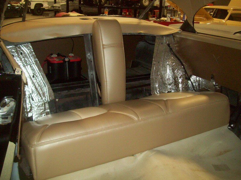 Tan leather car back seat installation.