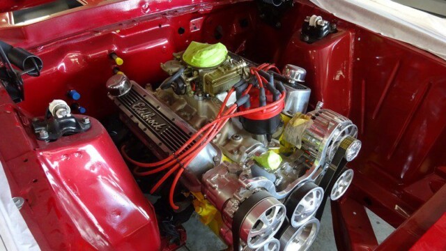 Red classic car engine detail.