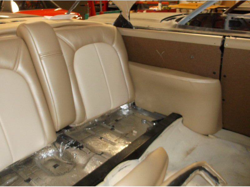 Beige car back seat installation.