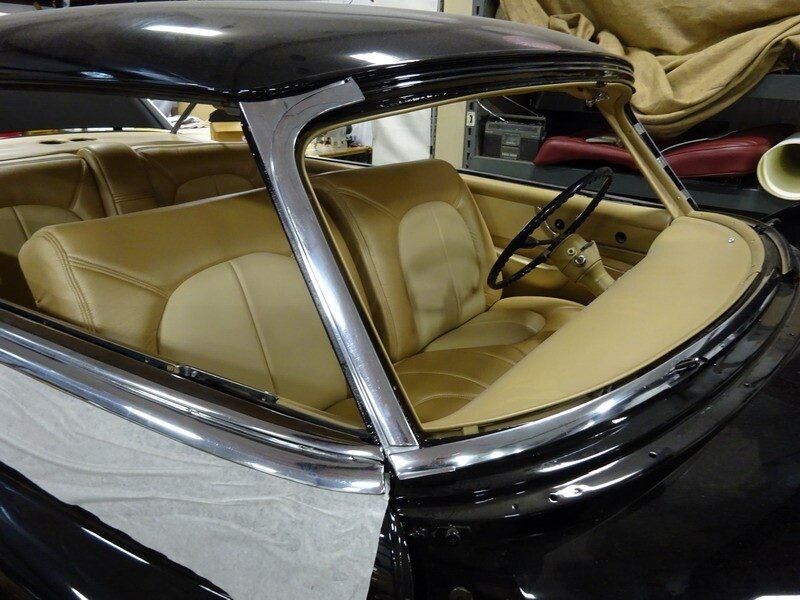 Classic car interior, tan leather seats.