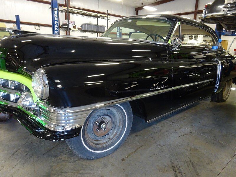 Black classic Cadillac under restoration.