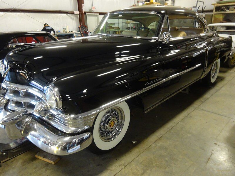 Black classic Cadillac coupe.