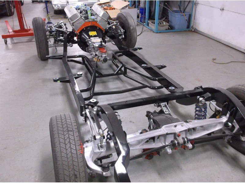 Classic car chassis under construction.