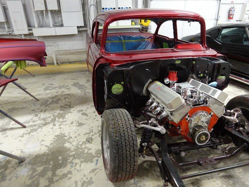 Red classic car engine restoration.