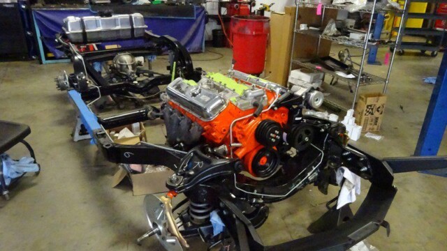 Car chassis with engine in progress.