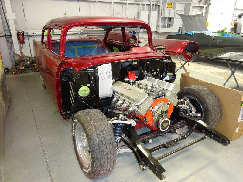 Red classic car engine restoration.