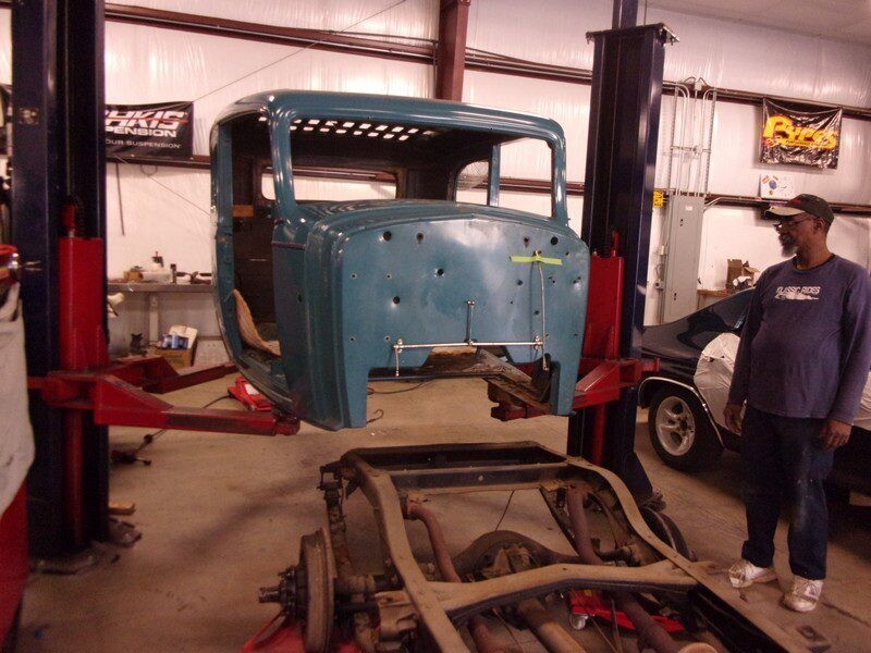 Classic car body restoration in progress.