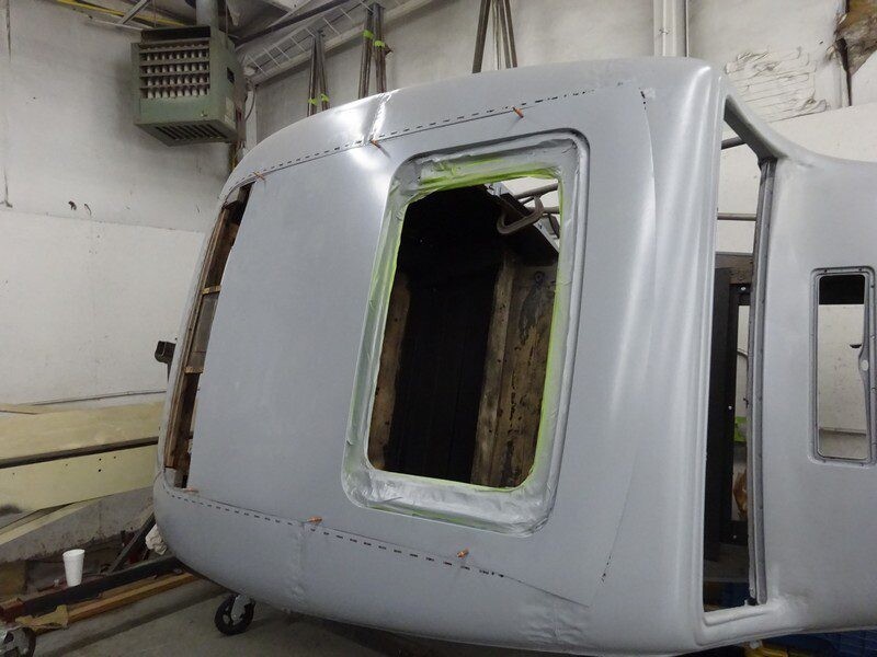 Primed car roof panel during restoration.