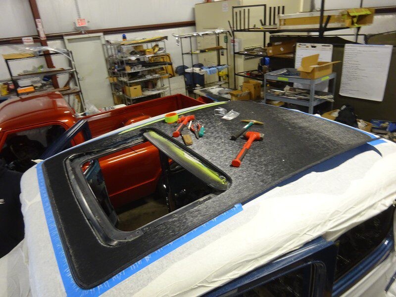 Car sunroof installation in progress.