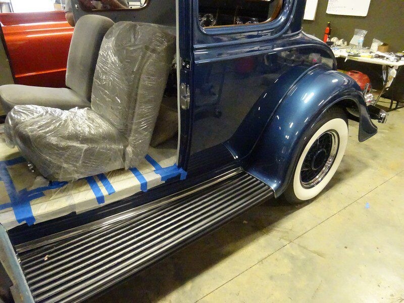 Dark blue vintage car interior, under restoration.