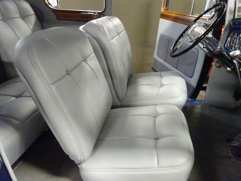 Classic car's light gray leather seats.
