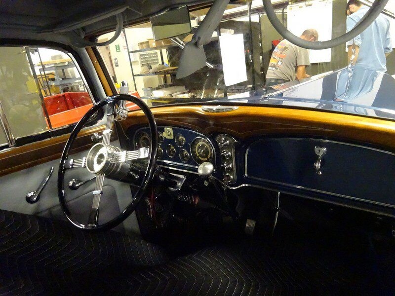 Vintage car interior, wood dashboard.