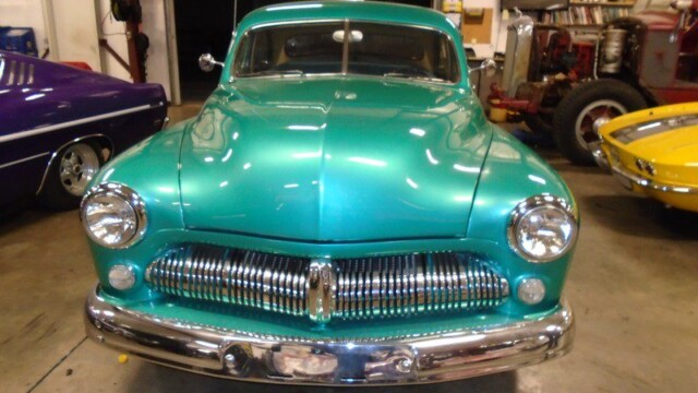 Teal 1950 Mercury car front view.