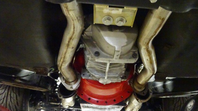 Underside view of car's exhaust system.