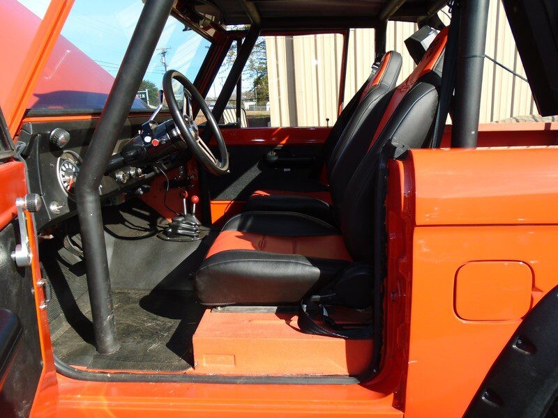 Orange Ford Bronco interior view.