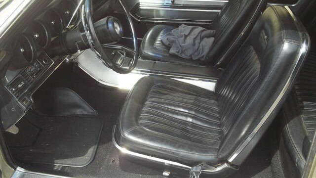 Classic car's black leather interior.