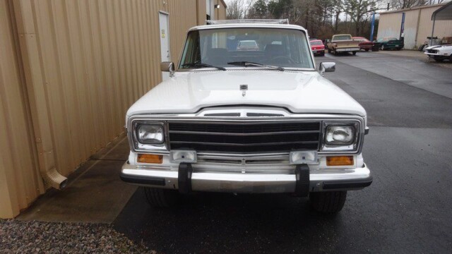 White Jeep Wagoneer classic SUV front.