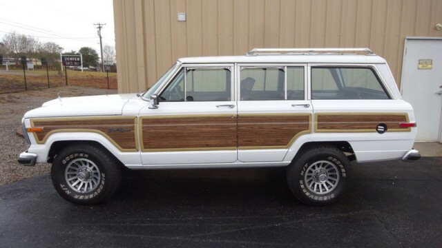 White and wood Jeep Wagoneer station wagon.