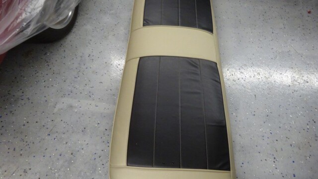Beige and black car seat back.