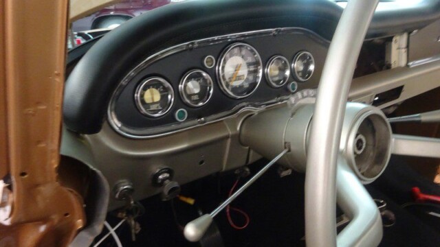Classic car dashboard and steering wheel.