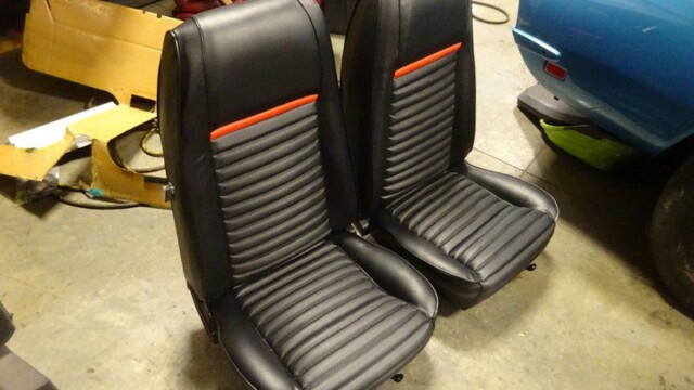Black car seats with red stripe.