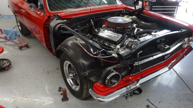 Red Chevrolet Chevelle SS engine bay restoration.