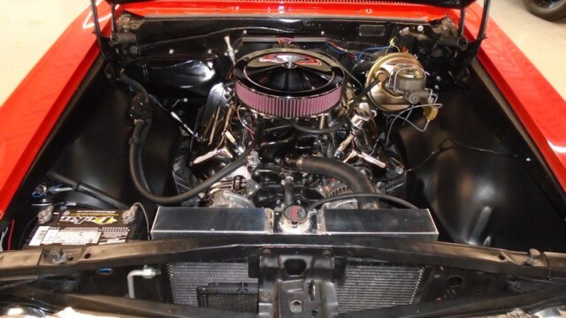 Shiny chrome air filter on classic car motor