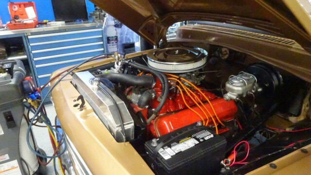 Classic car engine undergoing repair.