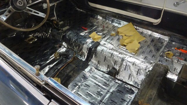 Classic car interior sound deadening installation.