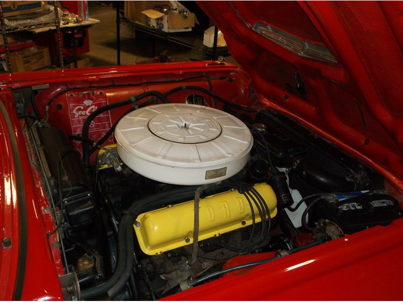 Red classic car engine detail.
